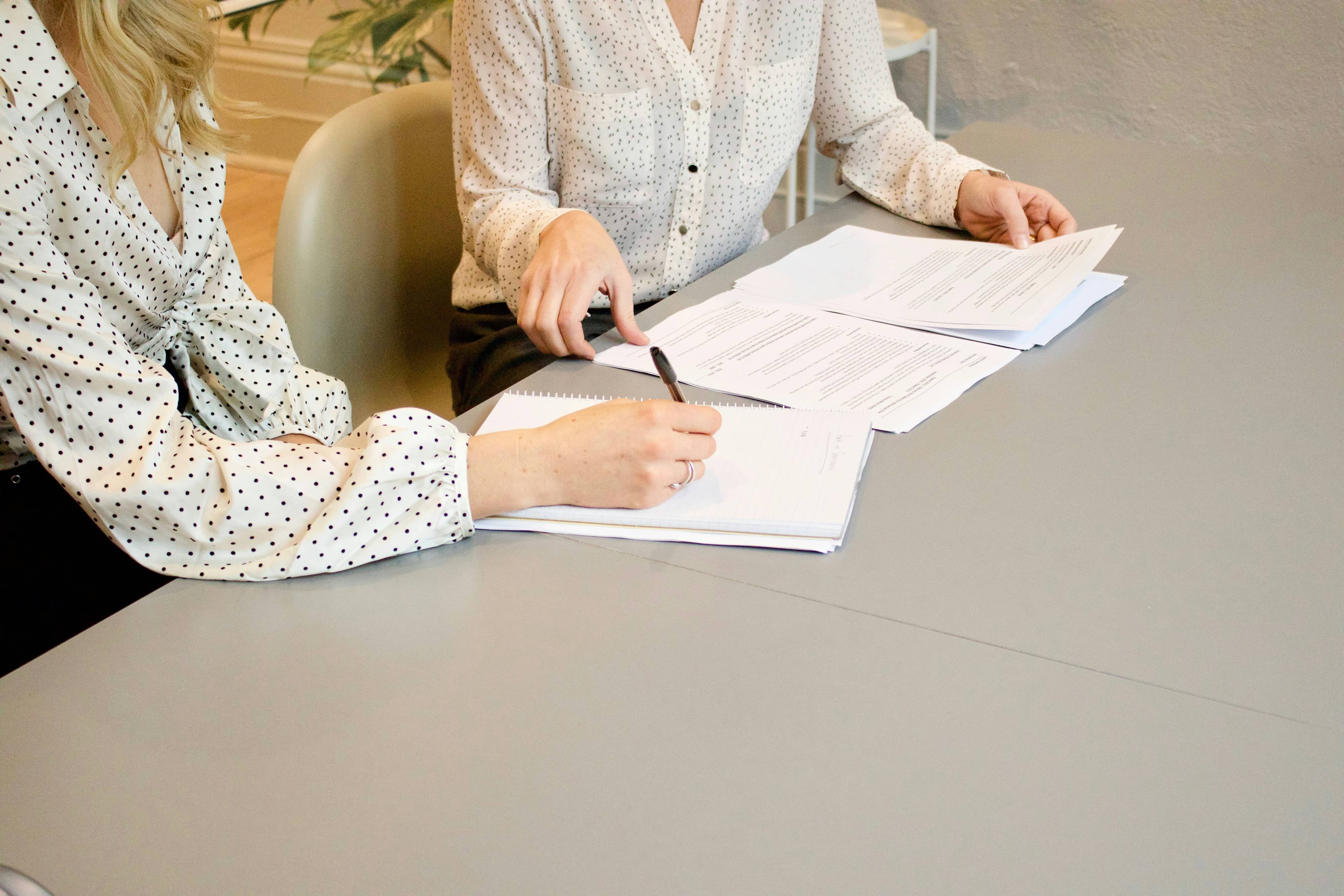 A translator going through paperwork with a client