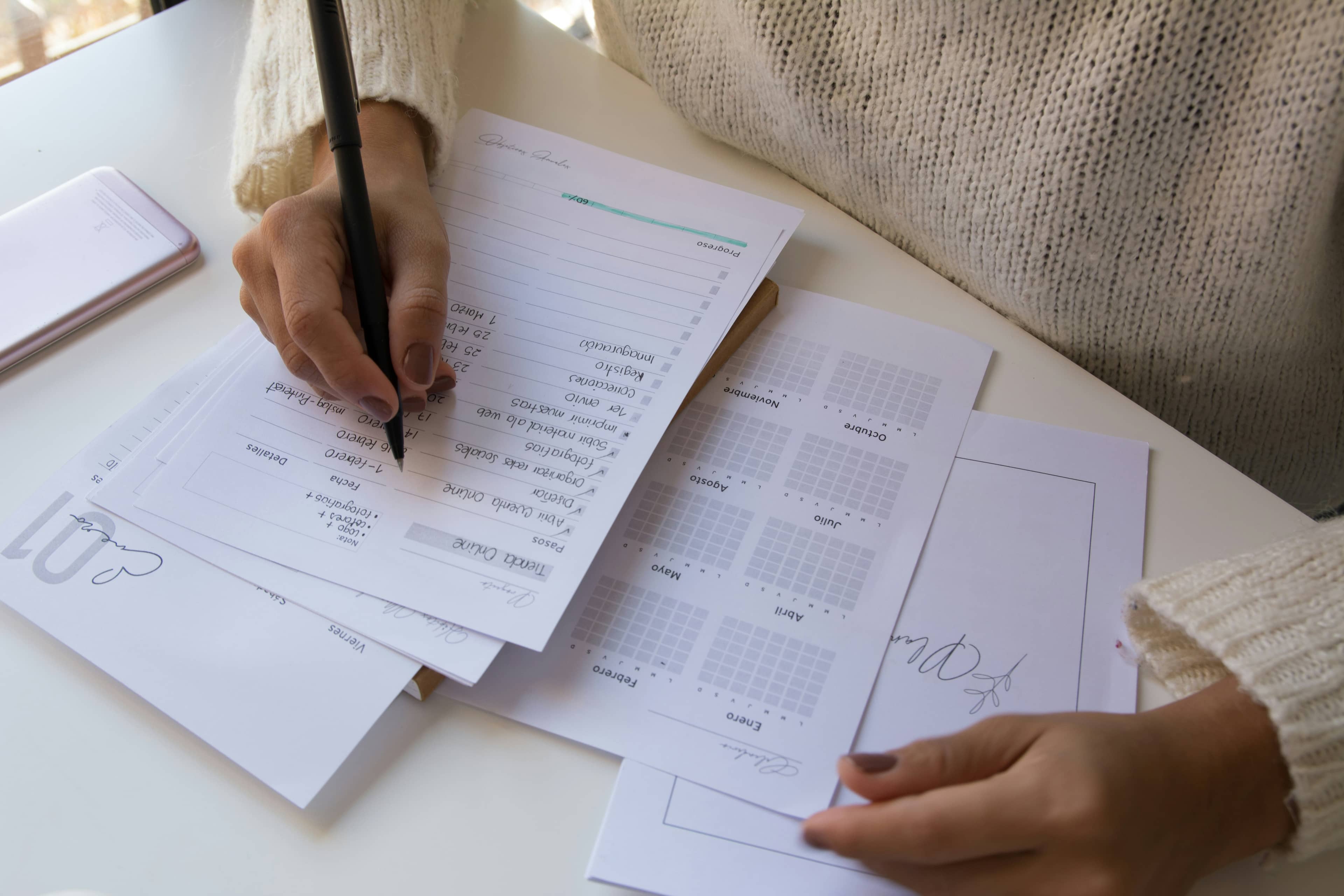 Close-up of a hand completing an official form