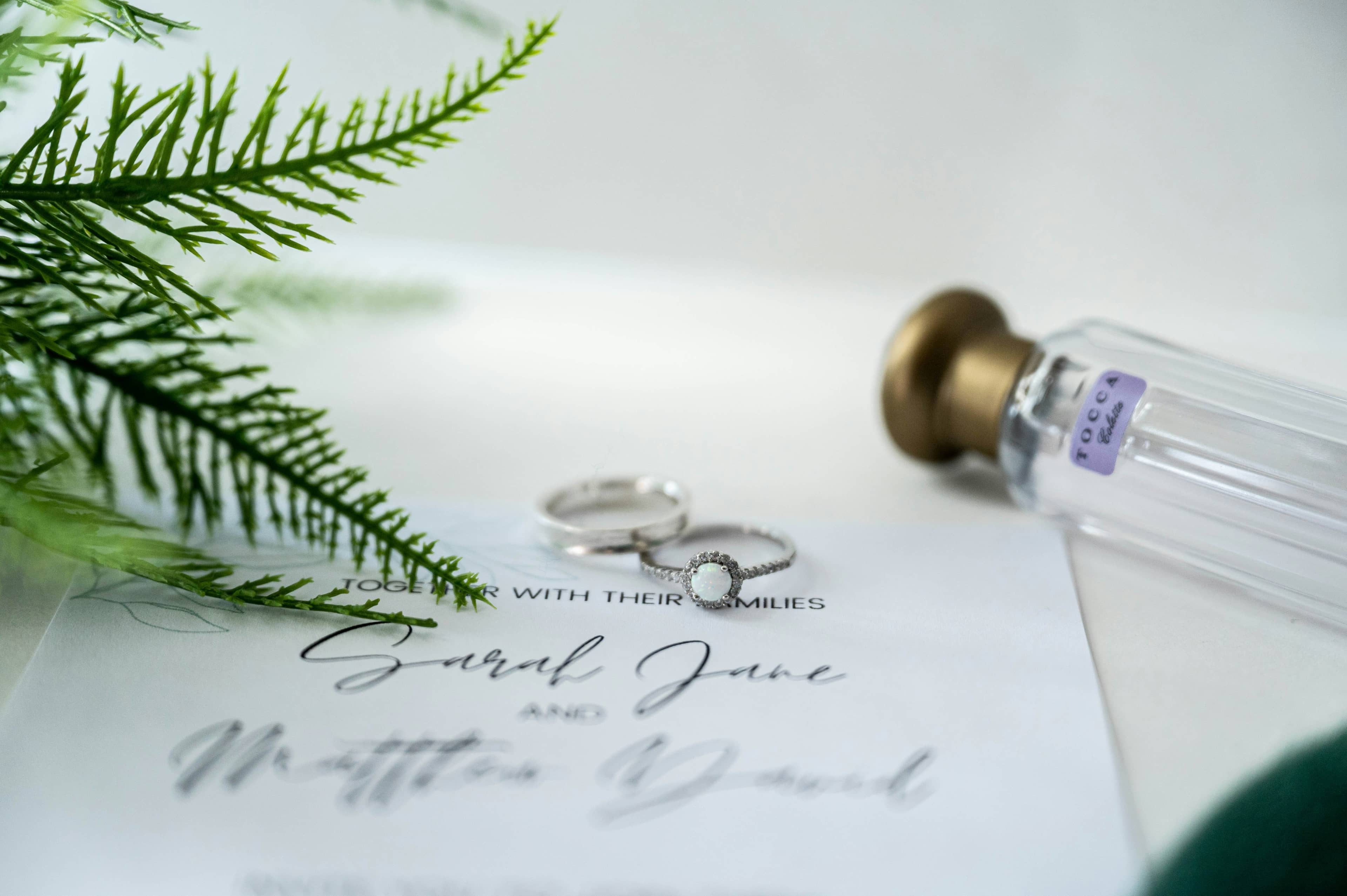 Two wedding rings resting on a printed document
